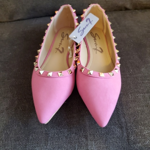 pink spiked loafers